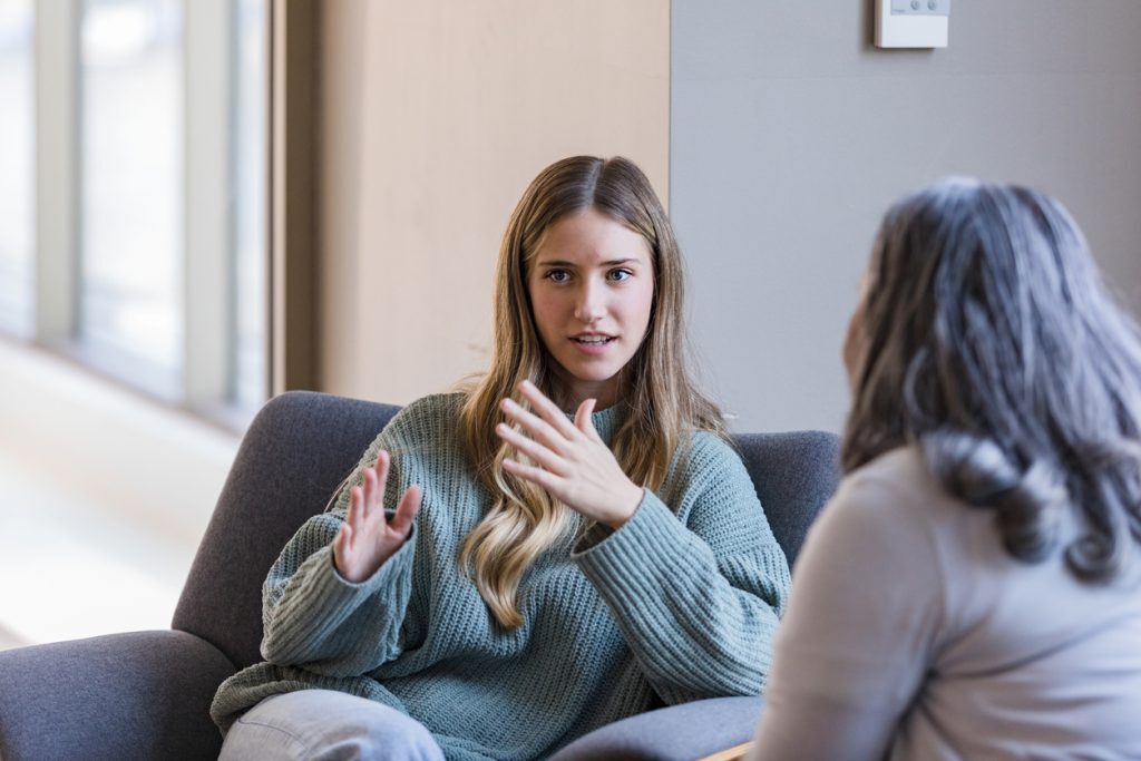 Woman speaking with a therapist during a counselling session - finding the right therapist.