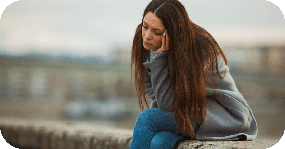 Woman looking depressed deep in thought