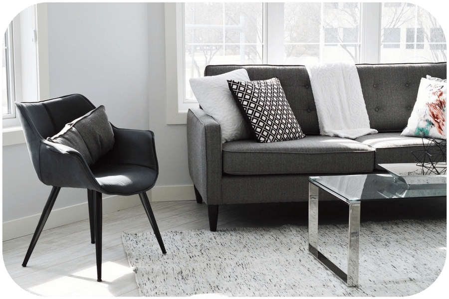 Inviting therapy space with a soft couch and armchair, designed for comfort and connection.